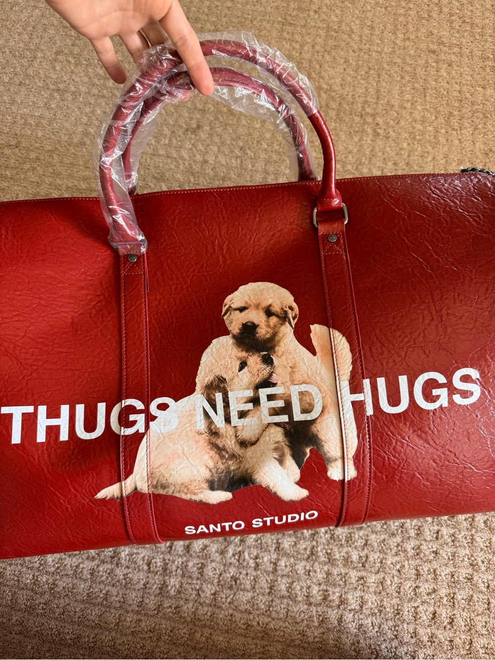 SANTO STUDIO JASMINE TOOKES THUGS NEED HUGS DUFFEL BAG RED